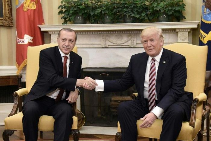 US President Donald Trump shakes hands with Turkish President Recep Tayyip Erdogan in the Oval Office
