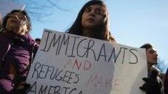 People protest outside the White House on February 4, 2017