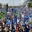 Tens of thousands of demonstrators attend the “Freedom March” in Warsaw, saying the rule of law is at stake
