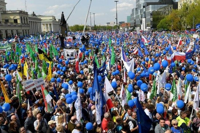 Tens of thousands of demonstrators attend the “Freedom March” in Warsaw, saying the rule of law is at stake