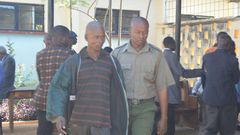 Kevin Simiyu is led outside Bungoma law court he was jailed for fifteen months on Thursday, March, 2017 after pleading guilty to performing sexual acts with a hen.