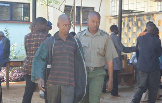 Kevin Simiyu is led outside Bungoma law court he was jailed for fifteen months on Thursday, March, 2017 after pleading guilty to performing sexual acts with a hen.