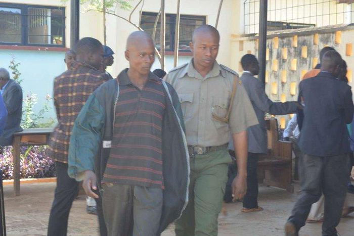 Kevin Simiyu is led outside Bungoma law court he was jailed for fifteen months on Thursday, March, 2017 after pleading guilty to performing sexual acts with a hen.