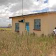 Ms Damaris Wambui Kamau, the mother of Dennis Ngaruiya, outside the house gifted to the family by President Uhuru Kenyatta but which she rejected saying it is substandard