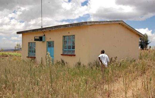 Ms Damaris Wambui Kamau, the mother of Dennis Ngaruiya, outside the house gifted to the family by President Uhuru Kenyatta but which she rejected saying it is substandard