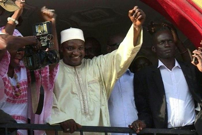 Gambia's President-elect Adama Barrow gestures to the crowd following his victory in the polls in Kololi on December 2, 2016