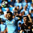Manchester City's Sergio Aguero (L) vies with Hull City's Andrew Robertson during their match at the Etihad Stadium in Manchester, north west England, on April 8, 2017