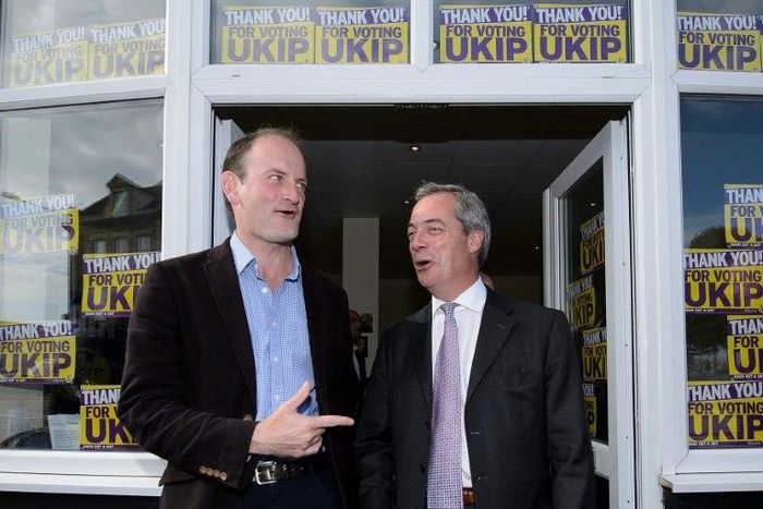 When times were better: Douglas Carswell (left) poses with then-UKIP boss Nigel Farage after being elected MP in 2014