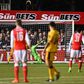 Arsenal's English midfielder Theo Walcott (R) watches his shot as he scores their second goal, his 100th goal for Arsenal, during the English FA Cup fifth round football match between Sutton United and Arsenal on February 20, 2017