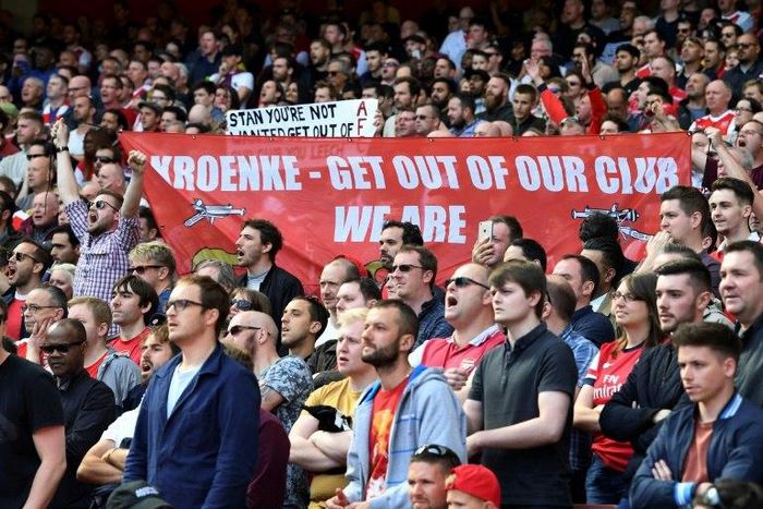 Arsenal fans hold up a banner against majority owner Stan Kroenke during an English Premier League football match at the Emirates Stadium in London on May 21, 2017
