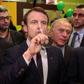 French presidential election frontrunner Emmanuel Macron (C) said he would forbid parliamentarians from employing family members, "to put an end to nepotism"