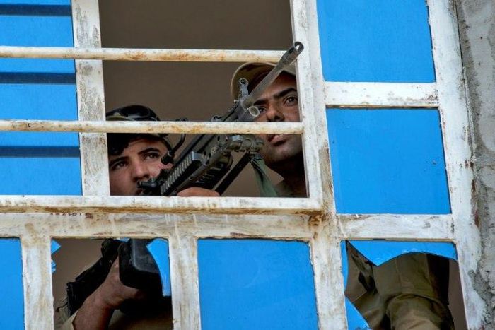 Iraqi forces guard a position in the northwestern al-Haramat neighbourhood of Mosul on May 9, 2017