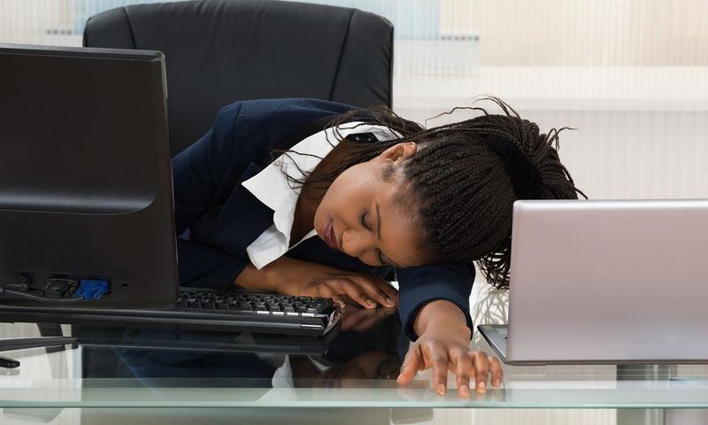 Tired woman at work(Medium)