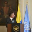 Colombian President Juan Manuel Santos (L) speaks next to Great Britain's Ambassador at the UN Matthew Rycroft in Bogota on May 4 2017