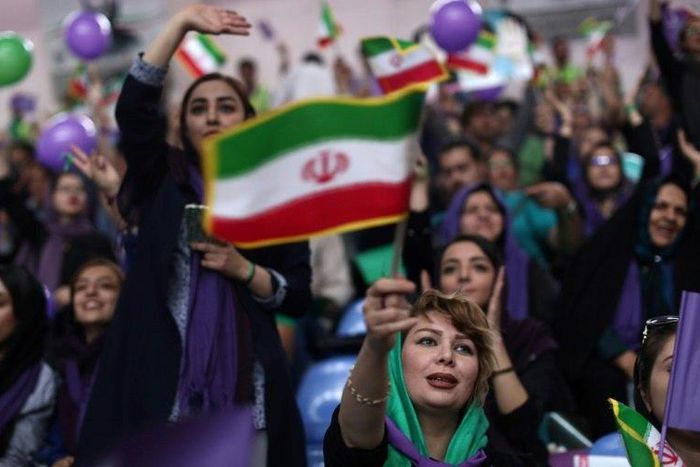 Supporters of incumHassan Rouhani chant slogans during a campaign rally in the northwestern city of Zanjan on May 16, 2017, ahead of the Iranian presidential election on Friday