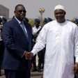 Senegalese president Macky Sall (L) shakes hands with his Gambian counterpart Adama Barrow upon his arrival at Dakar airport for a three-day official visit to Senegal, on March 2, 2017