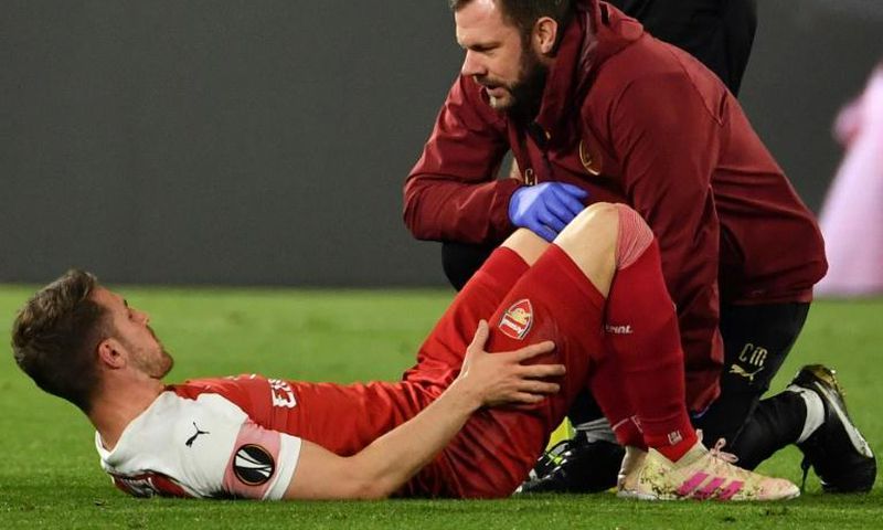 All over? Arsenal's Aaron Ramsey suffers a suspected hamstring injury