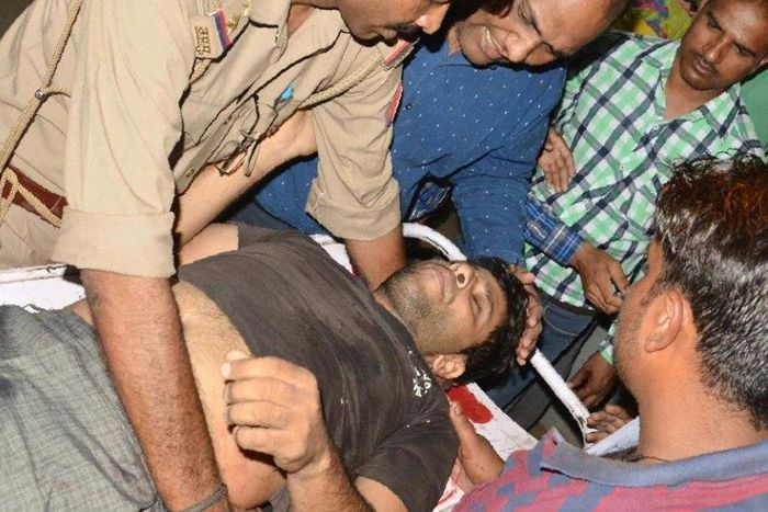 An Indian man injured in clashes between different castes is brought to a hospital in the Saharanpur district of Uttar Pradesh, on May 24, 2017