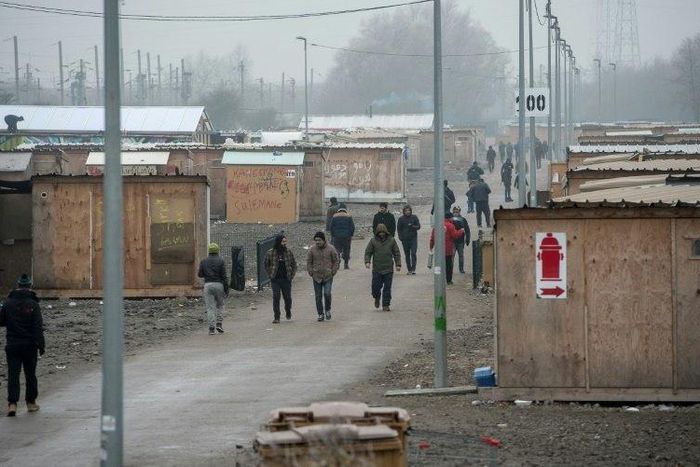 Migrants pictured inside the Grande-Synthe migrant camp in Grande-Synthe, near Dunkerque, northern France on January 25, 2017