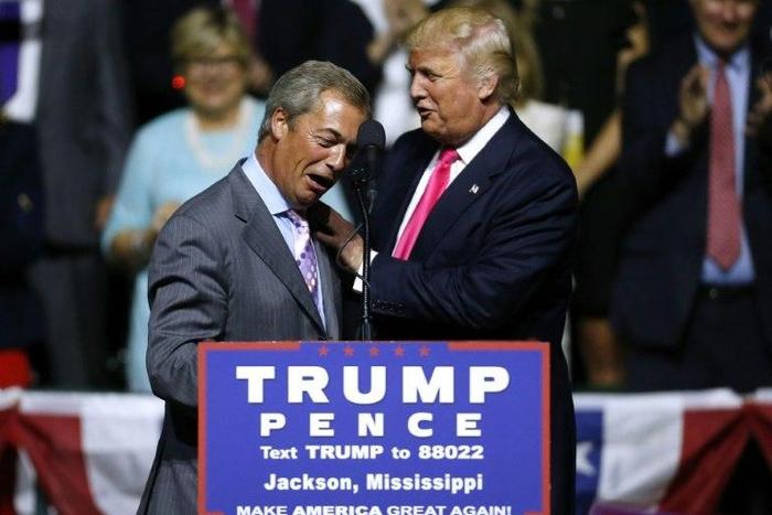 US President-elect Donald Trump greets United Kingdom Independence Party interim leader Nigel Farage during a campaign rally in Jackson, Mississippi, on August 24, 2016
