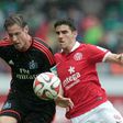 Mainz (red) and Hamburg (black), pictured in 2015, are both left on 34 points after Sunday's goalless draw, with Hamburg in the relegation play-off place due to their inferior goal difference