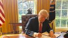 Trump signing the second version of his travel ban on March 6, 2017.