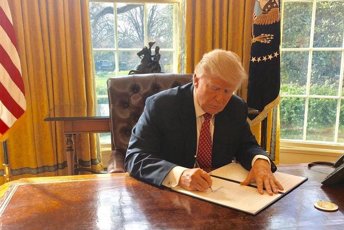 Trump signing the second version of his travel ban on March 6, 2017.