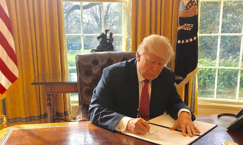 Trump signing the second version of his travel ban on March 6, 2017.