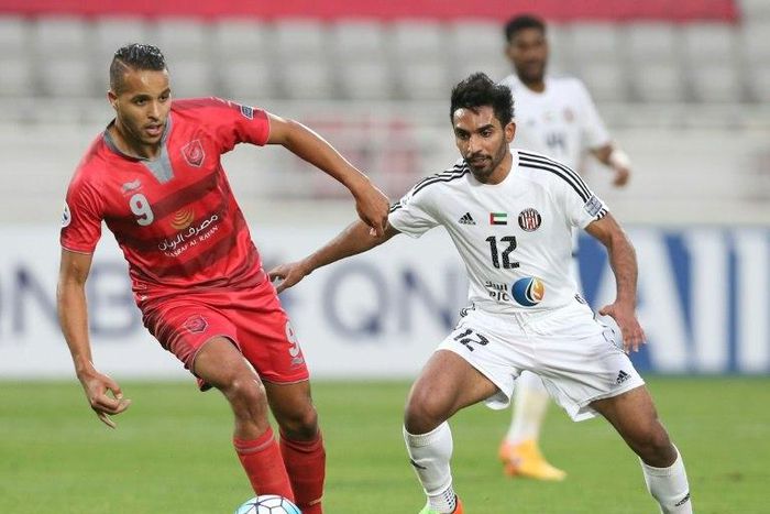 UAE's Al-Jazira player Salim Rashid (R) fights for the ball with Qatar's Lekhwiya player Youssef Al-Arabi during the Asian Champions League football match between Lekhwiya SC and Al-Jazira Club on February 20, 2017