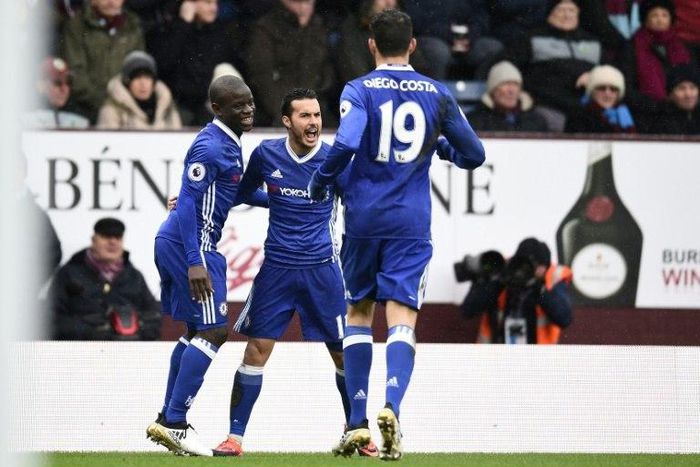 Chelsea's midfielder Pedro (2nd L) celebrates with teammates after scoring against Burnley on February 12, 2017