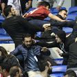 Besiktas' and Lyon's supporters fight before their UEFA Europa League first leg quarter final football match on April 13, 2017, at the Parc Olympique Lyonnais stadium in Decines-Charpieu, central-eastern France