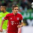 Bayern Munich's defender Philipp Lahm runs with the ball during the German first division Bundesliga football match between VfL Wolfsburg and Bayern Munich on April 29, 2017