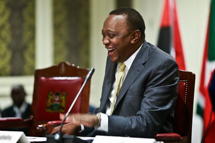President Uhuru Kenyatta laughing