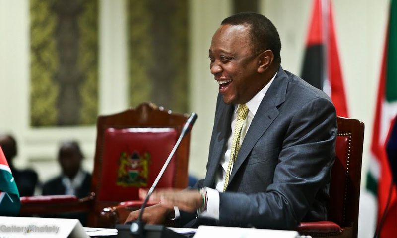 President Uhuru Kenyatta laughing