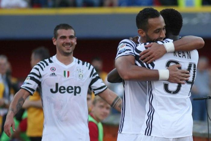 Juventus' Moise Kean (R) celebrates with teammate Medhi Benatia after scoring during their Italian Serie A football match at Bologna on May 27, 2017