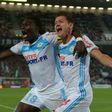 Marseille's Bafetimbi Gomis (L) celebrates after scoring a goal with teammate Florian Thauvin during their French Ligue 1 match against Bordeaux, at the Matmut Atlantique stadium in Bordeaux, on May 14, 2017