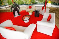 White couches and a red carpet