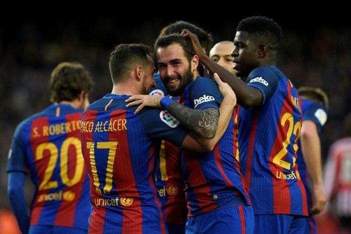 Barcelona's Alcacer celebrates with teammates after scoring a goal during their match against Athletic Club Bilbao at the Camp Nou stadium in Barcelona on February 4, 2017