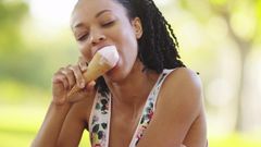 Woman enjoying ice-cream (Shutterstock)