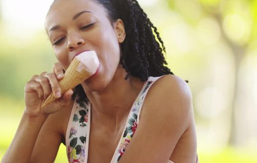Woman enjoying ice-cream (Shutterstock)