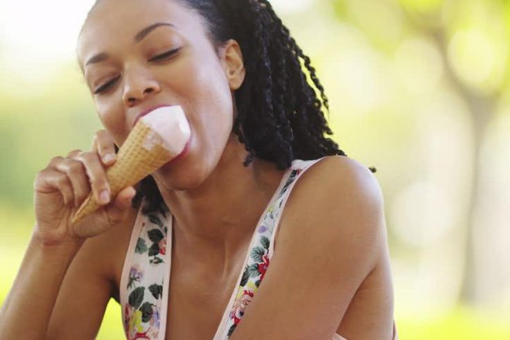 Woman enjoying ice-cream (Shutterstock)