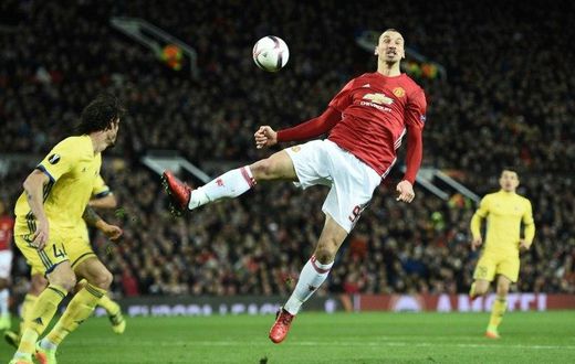 Manchester United's Zlatan Ibrahimovic (C) jumps for the ball during their UEFA Europa League match against FC Rostov, at Old Trafford in Manchester, on March 16, 2017