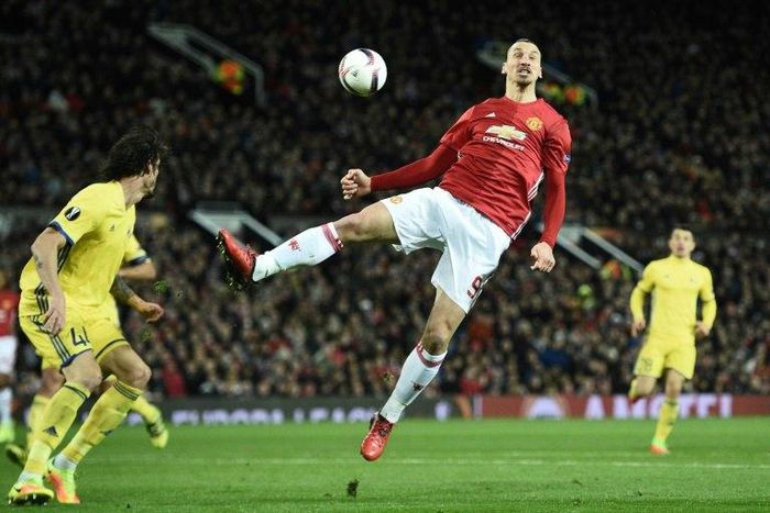Manchester United's Zlatan Ibrahimovic (C) jumps for the ball during their UEFA Europa League match against FC Rostov, at Old Trafford in Manchester, on March 16, 2017