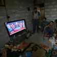 Members of the Iraqi armed forces watch Donald Trump giving a speech after he won the US presidential elections in November