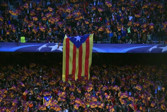 A giant Estelada, the flag for Catalan independence, is displayed by Barcelona supporters before a Champions League match at the Camp Nou stadium in Barcelona on April 19, 2017