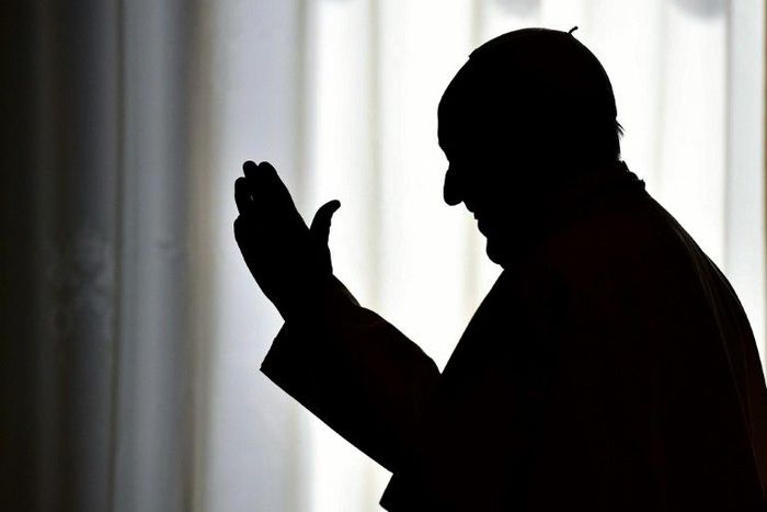 Pope Francis is silhouetted on March 24, 2017 at the Vatican