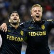 Monaco's Radamel Falcao (L) celebrates with teammate Kamil Glik after scoring a goal during their French Ligue 1 match against Olympique Lyonnais, in Decines-Charpieu, on April 23, 2017