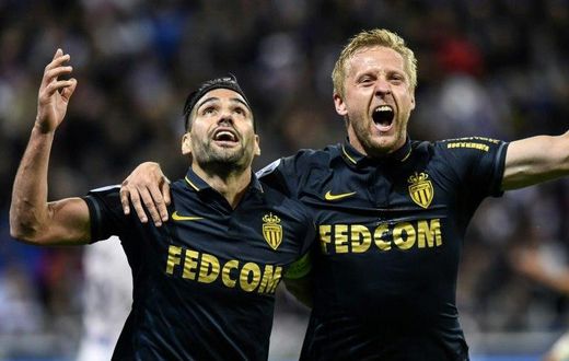 Monaco's Radamel Falcao (L) celebrates with teammate Kamil Glik after scoring a goal during their French Ligue 1 match against Olympique Lyonnais, in Decines-Charpieu, on April 23, 2017