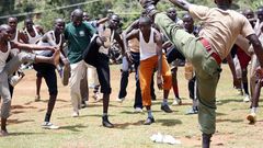 Prospective police recruits are guided during a physical exercise session at Kabarnet Stadium in Baringo Central on April 20, 2015.