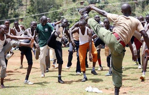 Prospective police recruits are guided during a physical exercise session at Kabarnet Stadium in Baringo Central on April 20, 2015.